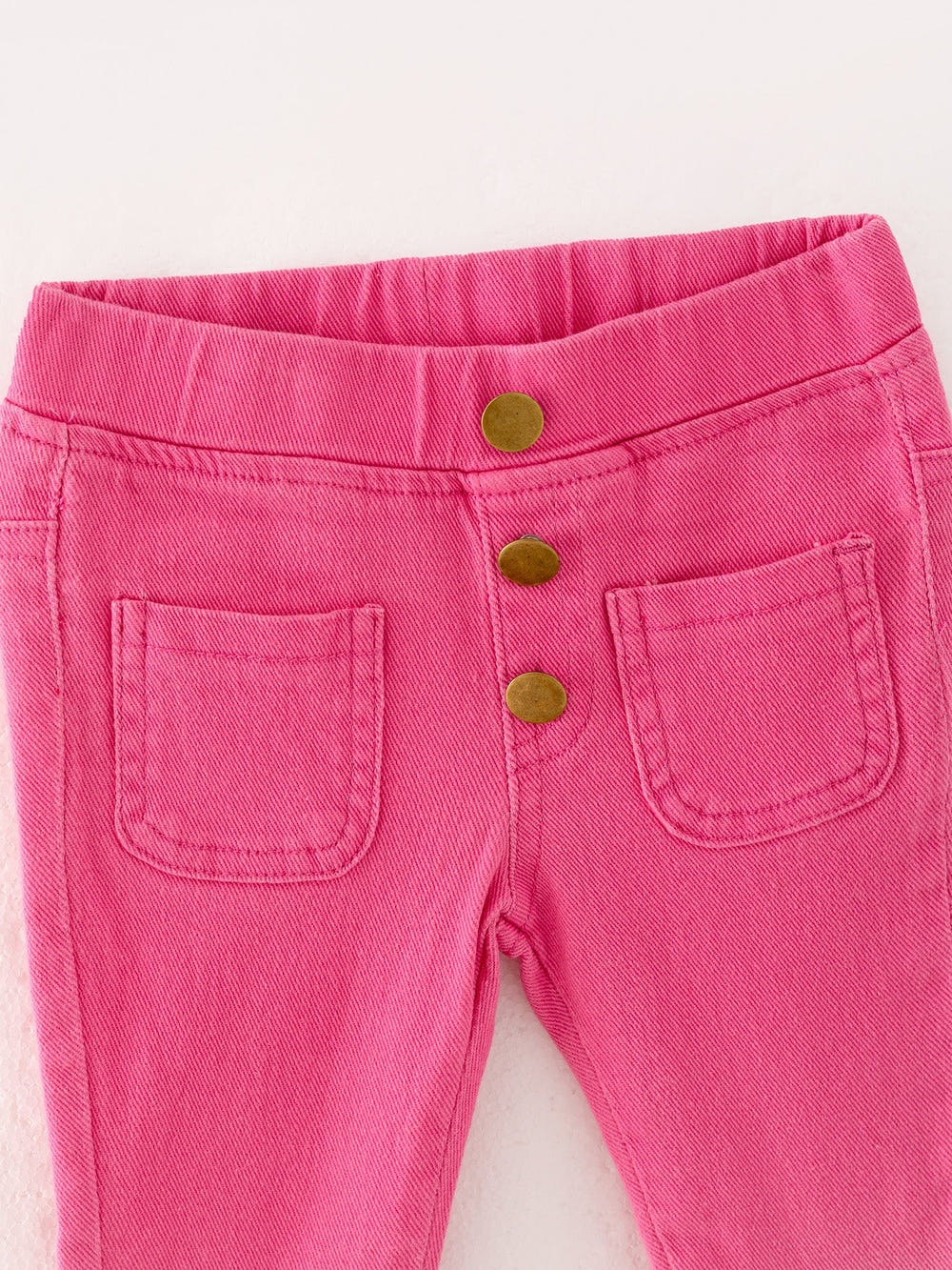 Pink gradient denim flared pants for babies, stylish and comfortable for everyday wear.