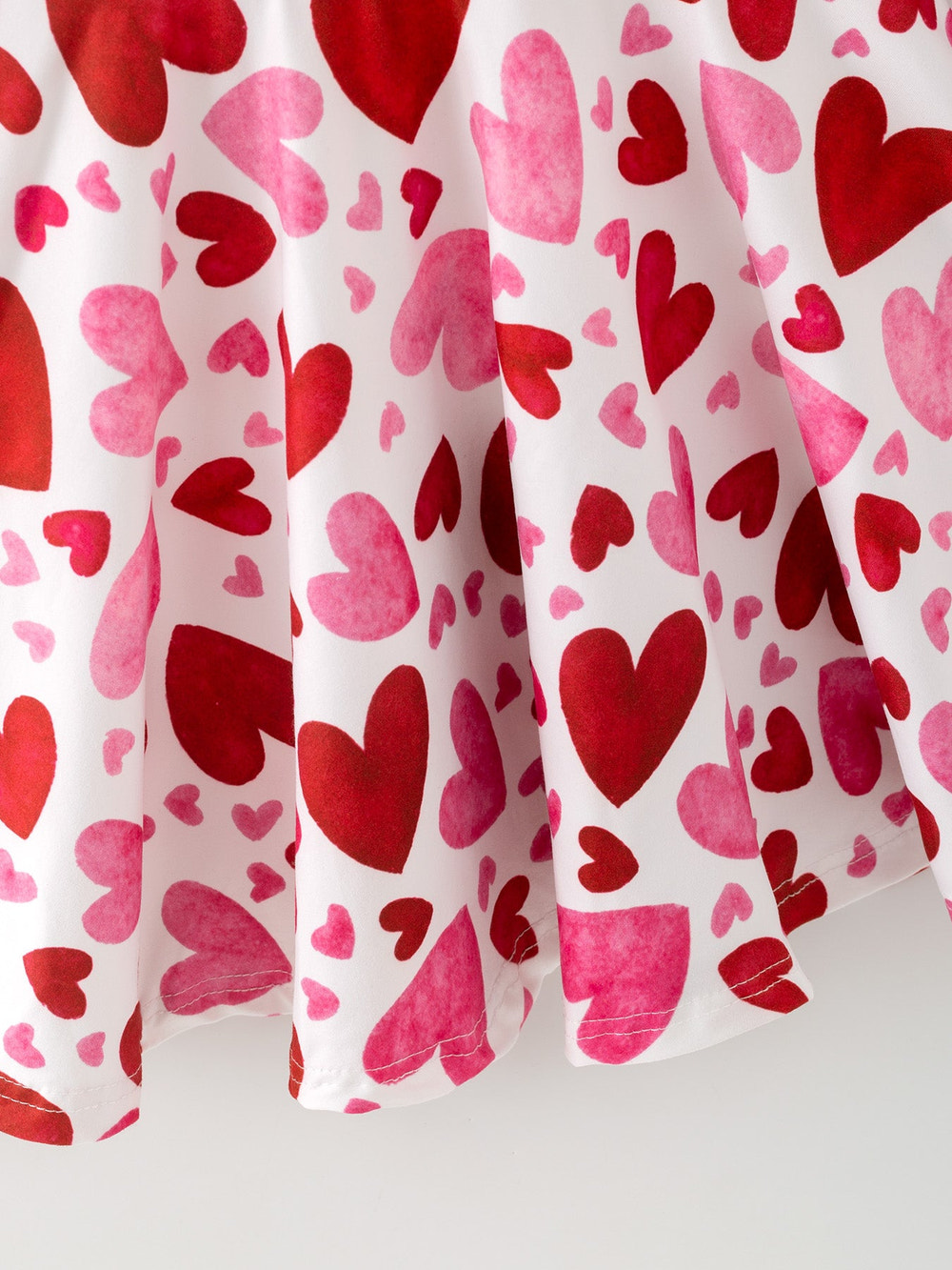 Toddler girls' cute pink and red heart print dress for Valentine's Day. Perfect for festive occasions!