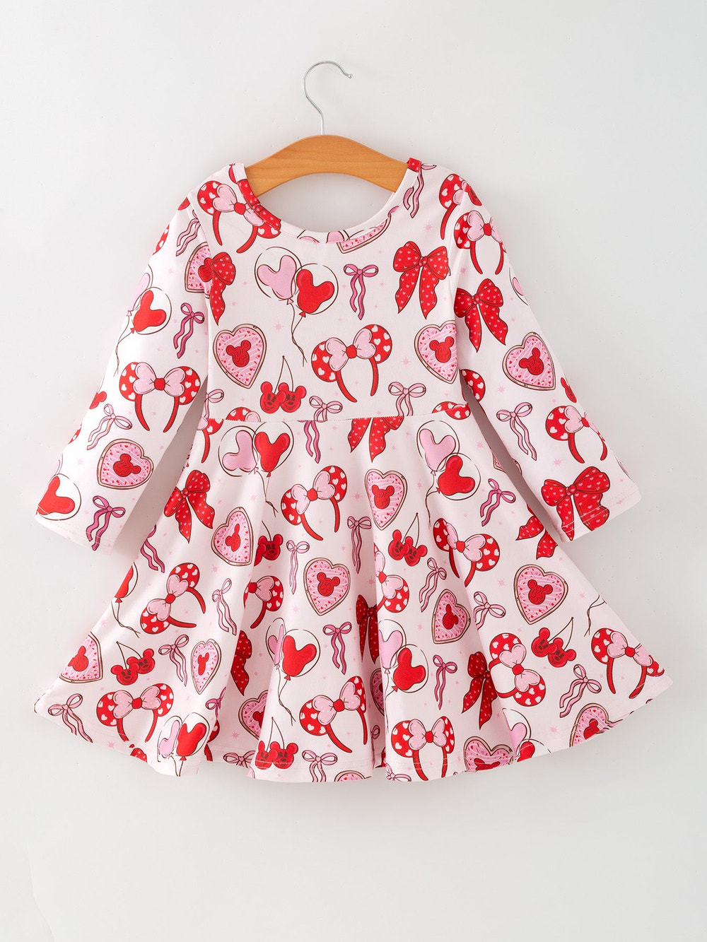 Toddler girls' Valentine party dress with bow and heart print, perfect for festive occasions.