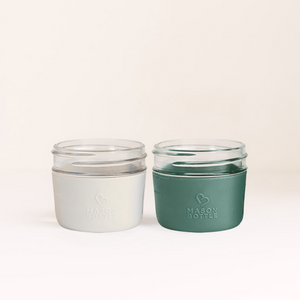 Silicone sleeve for cups, 2 pack, in various colors, designed for baby drinkware, angle view.