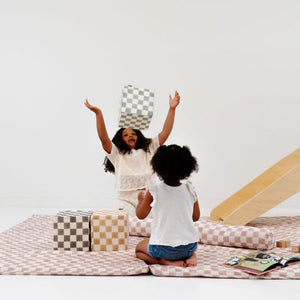 Checker Matcha Play Cube from an angle, showcasing its vibrant design and engaging play features for babies.