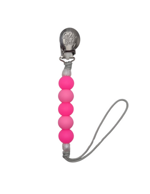 Glow in the dark pink pacifier clip for babies, perfect for keeping pacifiers secure and visible at night.