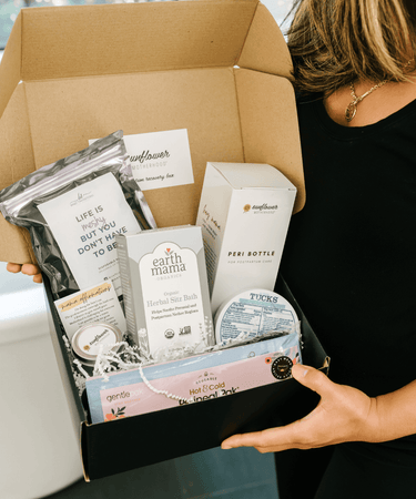 "Postpartum Recovery Box for new moms, featuring essential baby gift set items for comfort and care."
