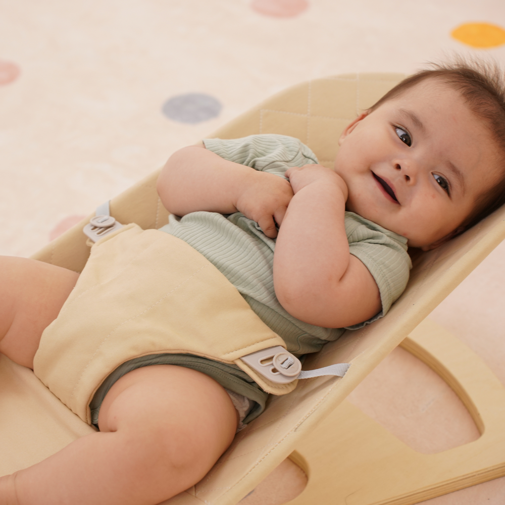Foldable Fir Baby Bouncer for indoor use, providing comfort and support for your little one.