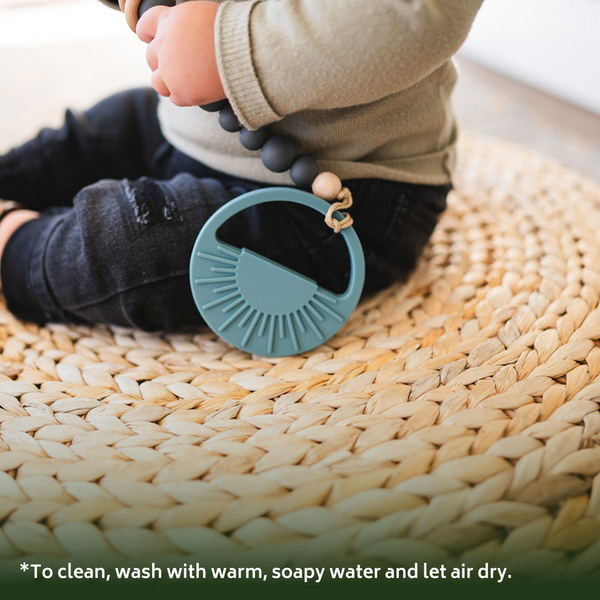 Sage Sunburst Teething Toy in angle 5 view, perfect for soothing babies' gums during teething.
