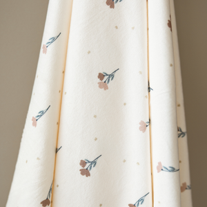 Minky Stretch Luxe Swaddle Blanket in soft fabric, perfect for cozying up your baby. Angle view showcasing design.