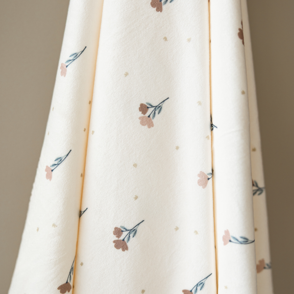 Minky Stretch Luxe Swaddle Blanket in soft fabric, perfect for cozying up your baby. Angle view showcasing design.