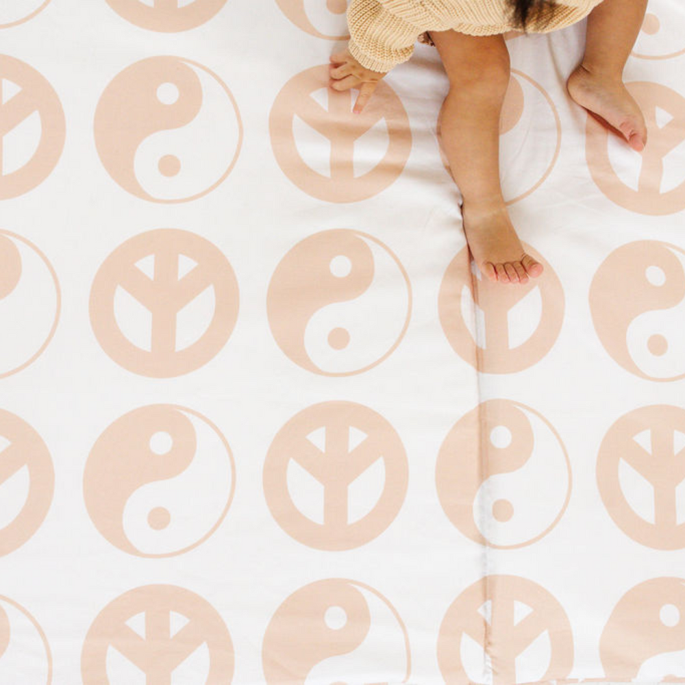 Yin Yang Organic Cotton Play Mat for babies, featuring a stylish design and soft, safe surface for playtime.