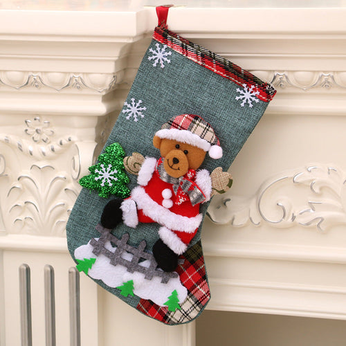 Santa Claus socks with Christmas tree pendant, festive holiday decorations at angle 11.