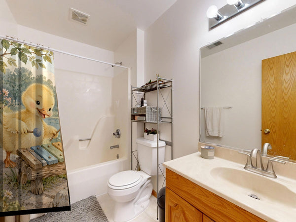Duckling Xylophone shower curtain on a tub shower combo in an American family bathroom