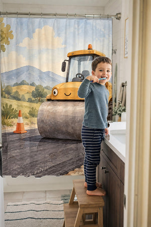 Child brushing teeth in a family bathroom with the Road Roller shower curtain