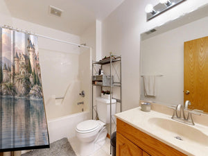 Lakeside Castle Fairy Tale shower curtain on a tub shower combo in an American family bathroom