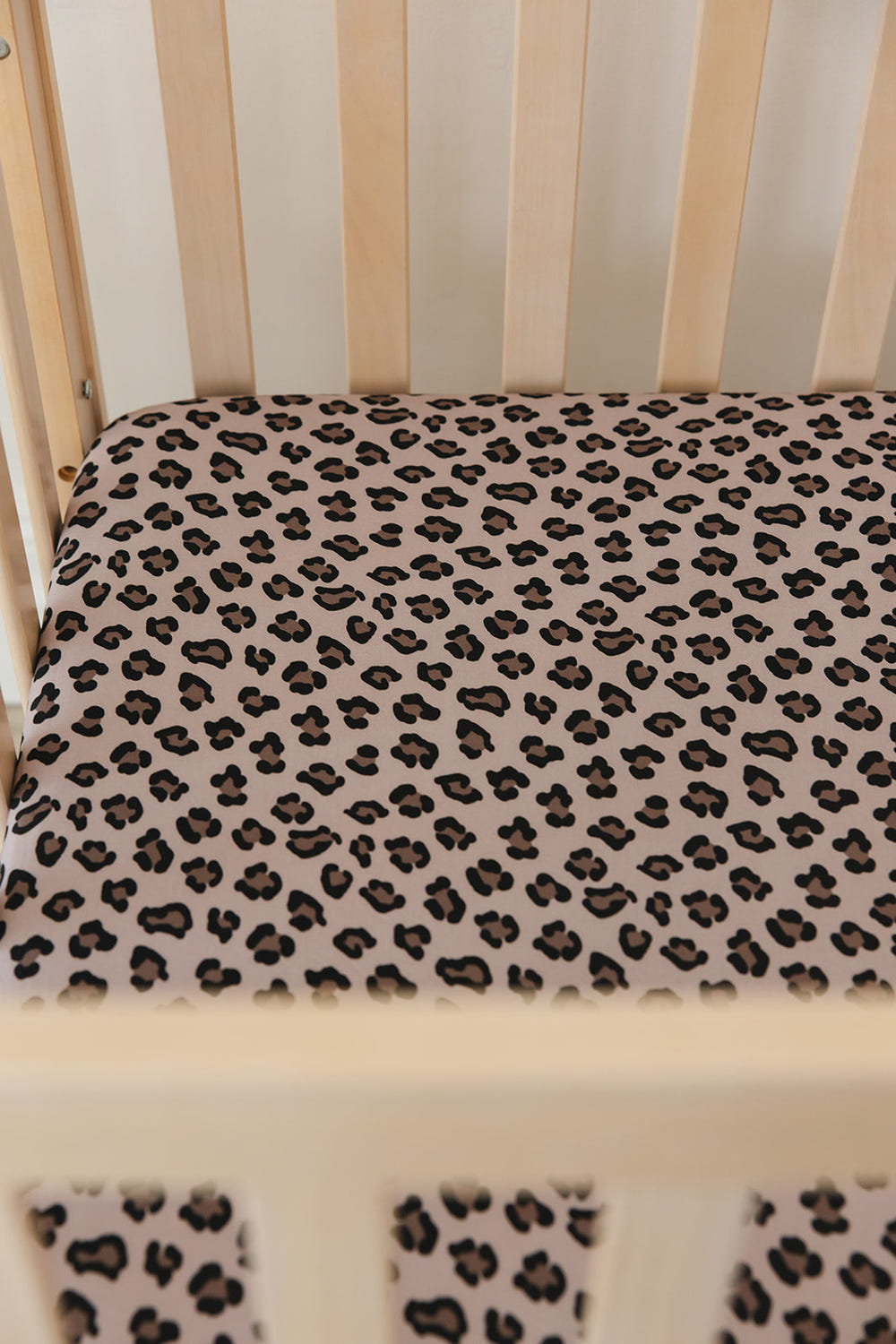 WILD Crib Sheet - Soft, breathable bedding for a cozy and stylish nursery sleep environment.