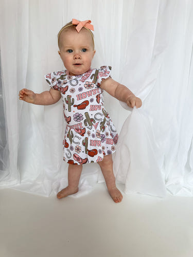 Howdy Darling Baby Twirl Dress in vibrant colors, perfect for playful and stylish little ones.