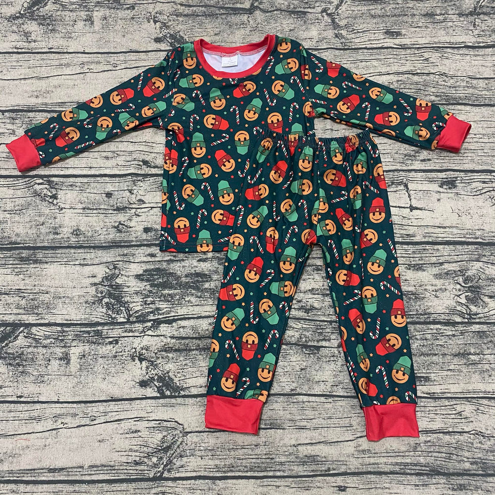 Smiley candy cane PJ set for babies, perfect for festive playtime and cozy sleep.