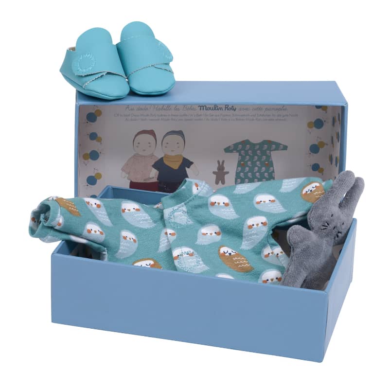 Assorted Moulin Roty baby clothes for dolls, perfect for imaginative play and dressing up.