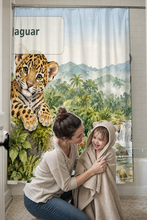 Mom drying her toddler in a hooded towel in front of the J is for Jaguar Alphabet shower curtain