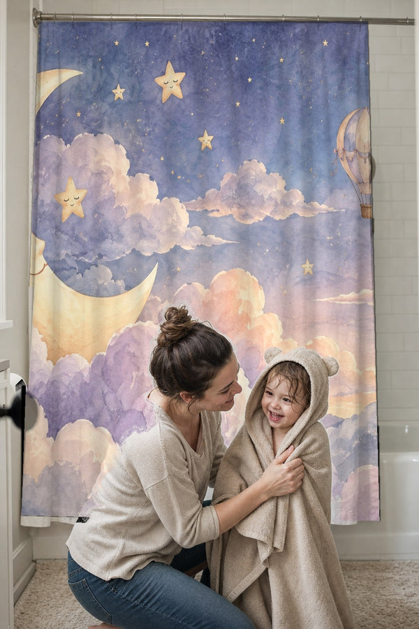 Mom drying her toddler in a hooded towel in front of the Twilight Moon Hot Air Balloon shower curtain
