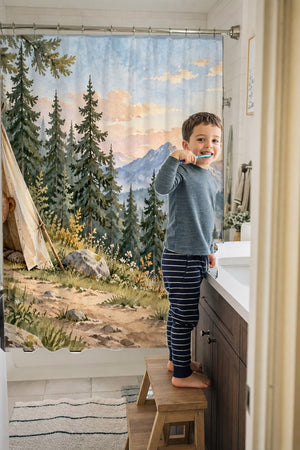 Child brushing teeth in a family bathroom with the Bear Tent Sunrise Camping shower curtain