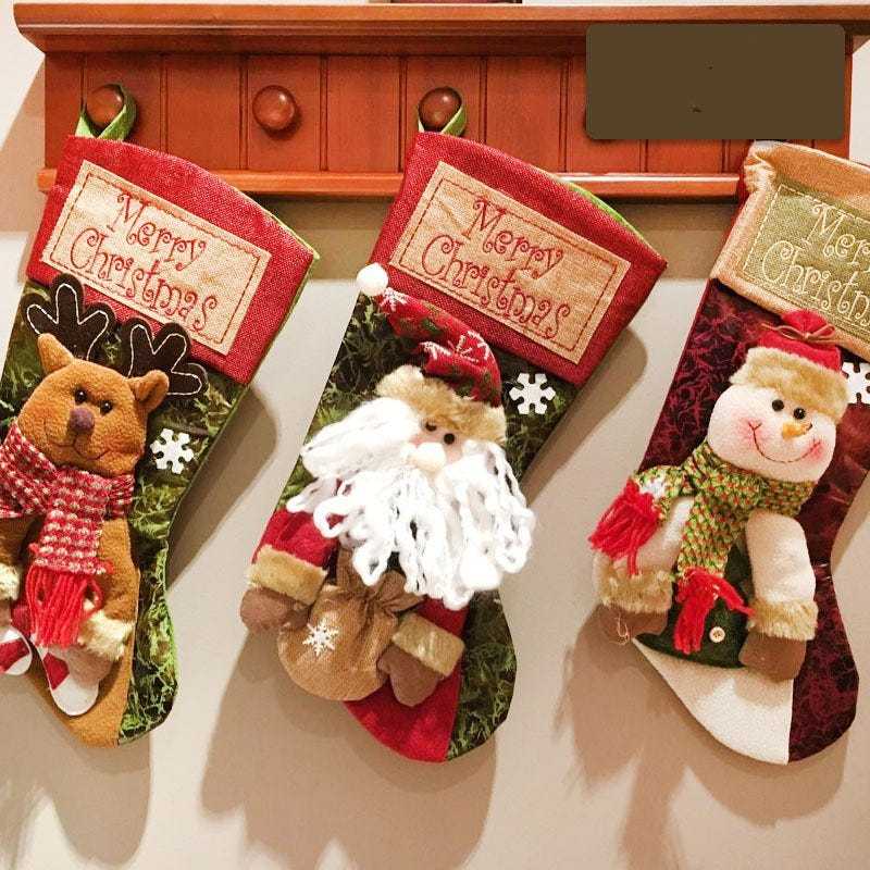 "Christmas stocking featuring Santa and snowman decor, perfect for festive baby celebrations."
