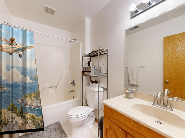 Coastal Explorer shower curtain on a tub shower combo in an American family bathroom