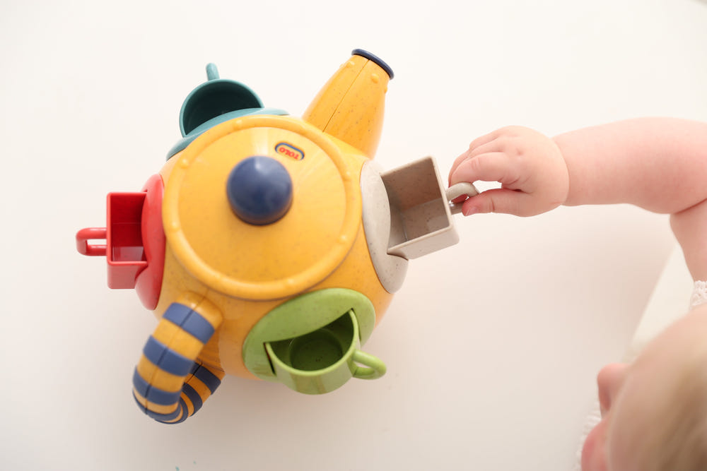 Teatime Shape Sorter by TOLO - colorful early learning toy for babies, promoting shape recognition and motor skills.