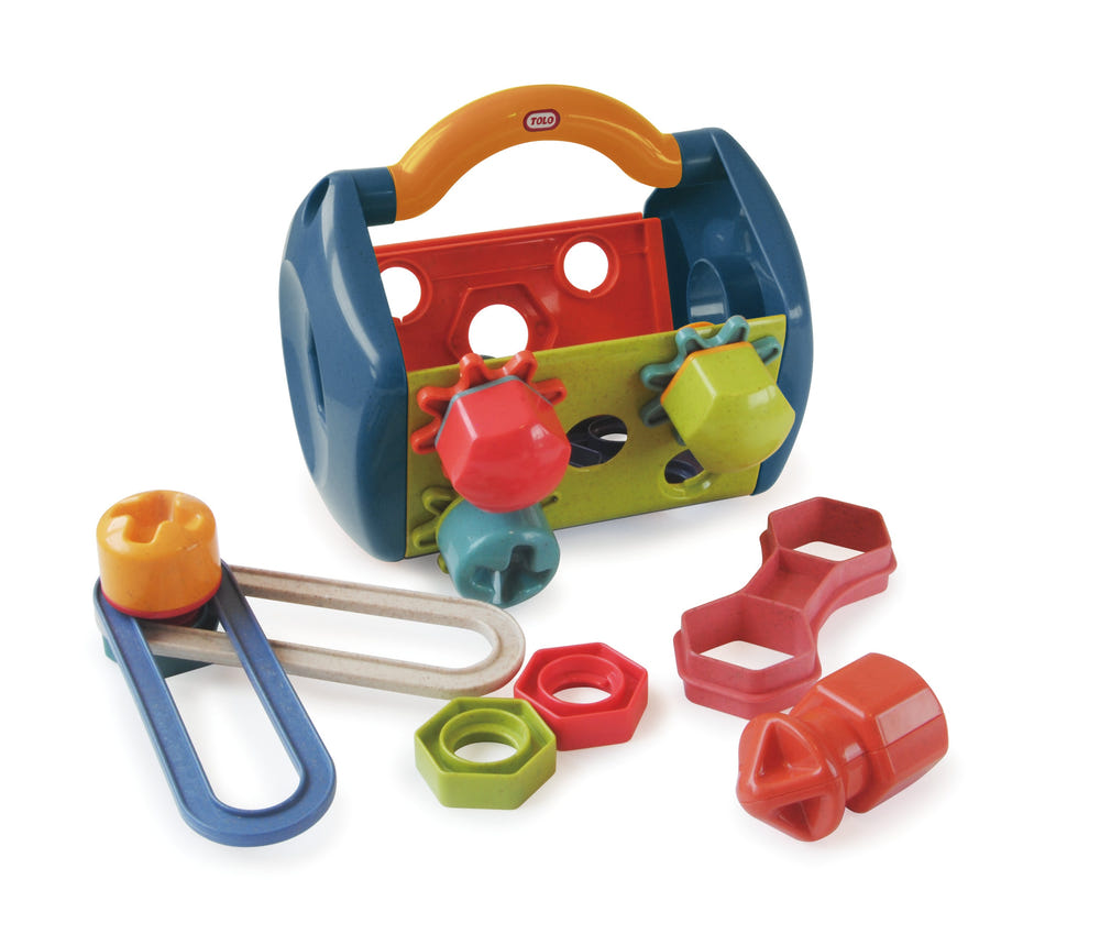 Colorful TOLO Tool Box for early learning, featuring various tools for imaginative play and skill development.