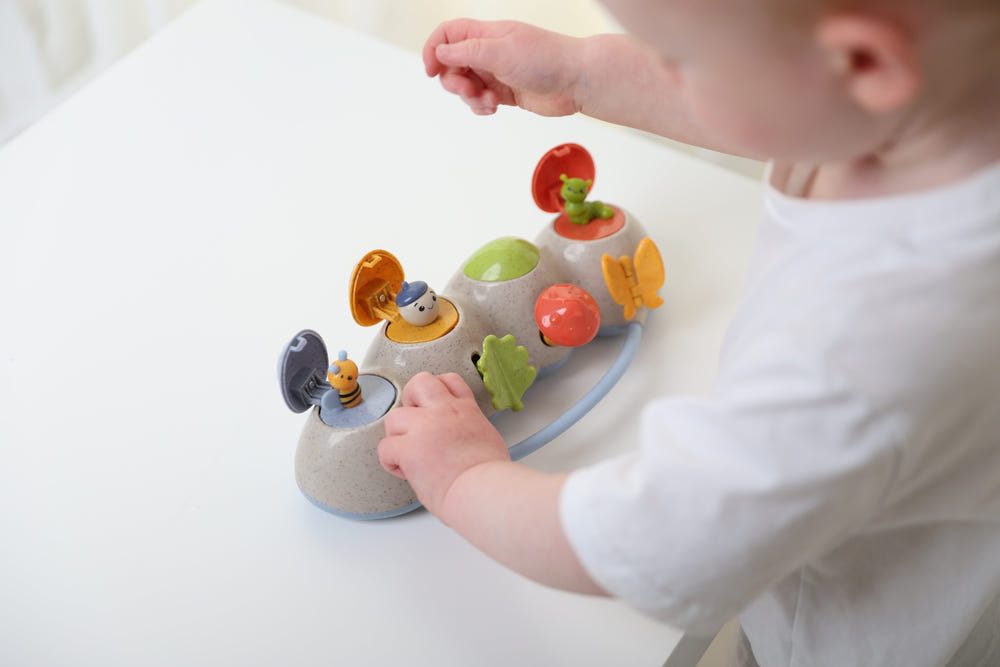 Woodland Pop Up early learning toy for babies, featuring colorful animals and interactive play elements.
