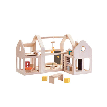 "Slide N Go Dollhouse bedding set for babies, featuring colorful designs for a cozy sleep environment."