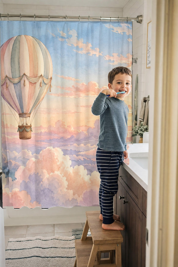 Child brushing teeth in a family bathroom with the Sunrise Hot Air Balloon shower curtain