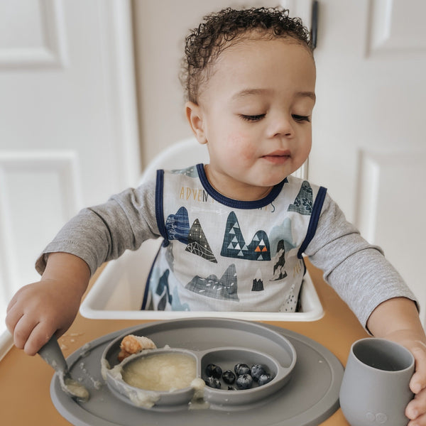"Adventure Awaits Bapron in Angle 14, perfect for mess-free feeding and playful exploration for babies."