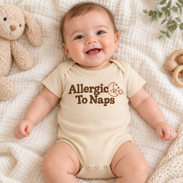 Baby wearing the Allergic To Naps baby bodysuit