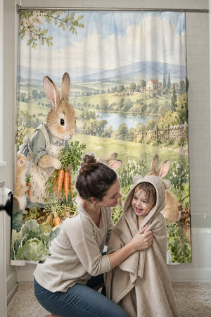 Mom drying her toddler in a hooded towel in front of the Bunny Garden Farm shower curtain