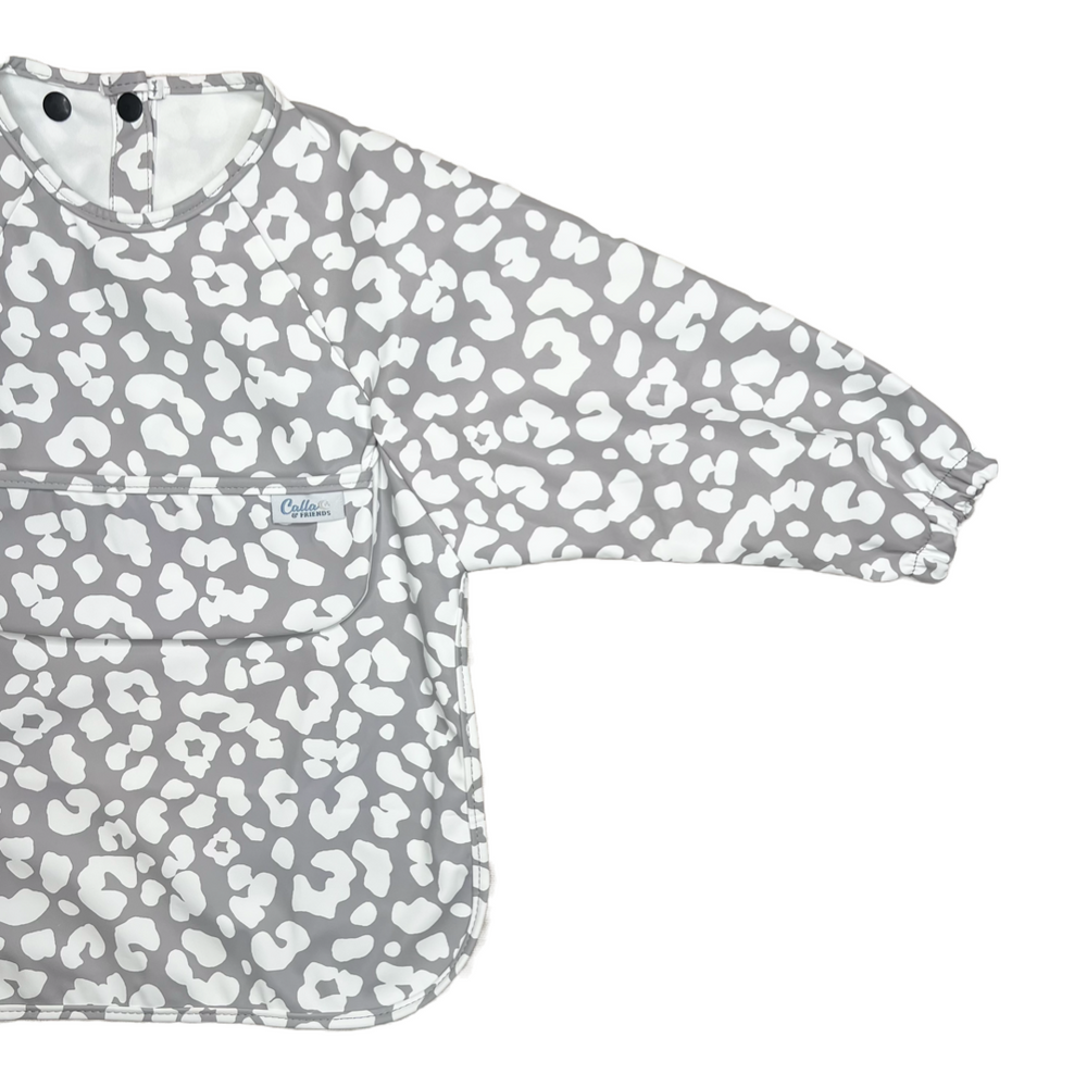 Grayson Long Sleeve Bib in Leopard print for babies, perfect for mess-free mealtime fun.