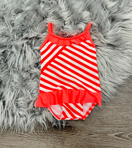 Billieblush baby swimsuit in vibrant colors, perfect for summer fun and playtime at the beach or pool. Angle 2 view.
