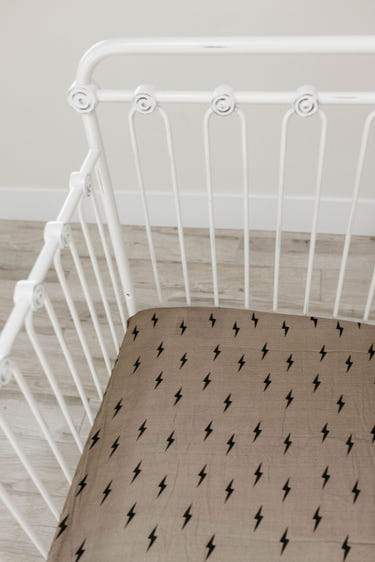 Muslin crib sheet featuring a lightning bolt design, perfect for stylish and cozy nursery decor.
