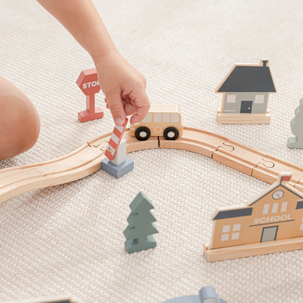 Colorful 100-piece wooden train set for toddlers, perfect for imaginative play and learning, angle view.