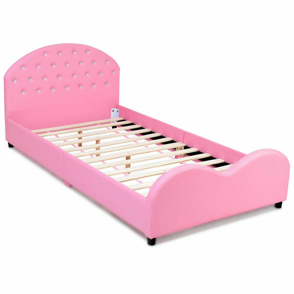 Twin size upholstered toddler bed with wood slat support, angled view showcasing design and comfort for kids' sleep.