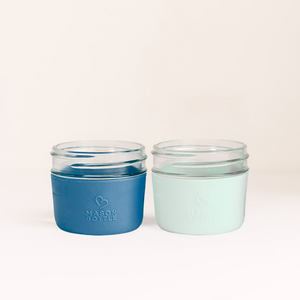 Silicone sleeve 2 pack for baby cups, providing a secure grip and vibrant colors for safe drinking.