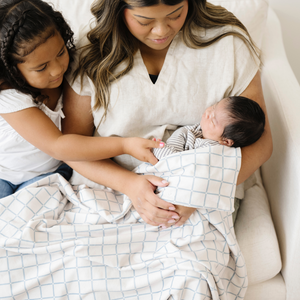 Soft Minky Stretch Receiving Blankets in various colors, perfect for swaddling and keeping your baby cozy.