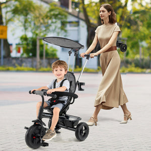 7-in-1 Baby Stroller Tricycle in gray with adjustable canopy and foldable footrests for ages 9-60 months, angle view.