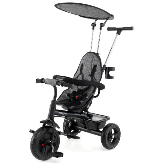 7-in-1 Baby Stroller Tricycle in gray with adjustable canopy and foldable footrests for ages 9-60 months, angle 3 view.