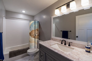 Moon Bear shower curtain pulled open in a gray kids bathroom