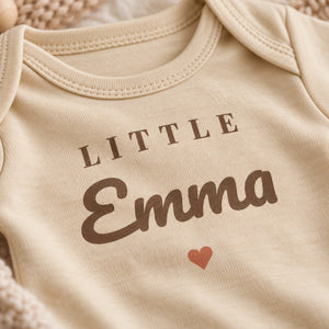 Close-up of the Little Name baby bodysuit print