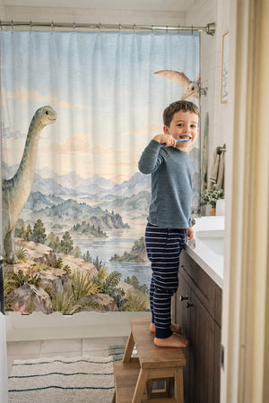 Child brushing teeth in a family bathroom with the Mountain Dinosaur shower curtain