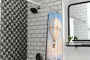 Mountain Hot Air Balloons shower curtain in a modern farmhouse bathroom with subway tile