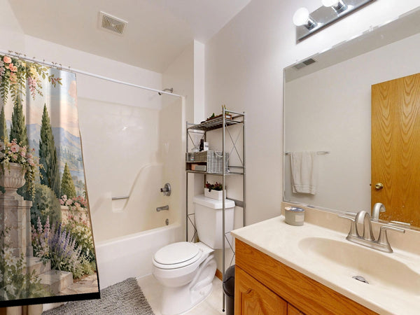 Castle Garden Fairy Tale shower curtain on a tub shower combo in an American family bathroom