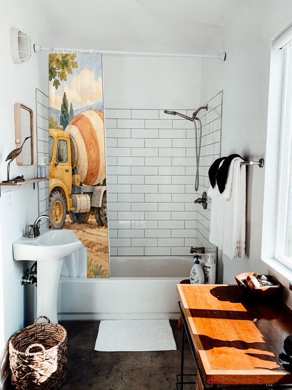 Cement Mixer shower curtain hanging on the rod over a white bathtub