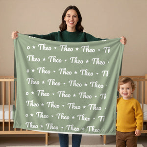 Name Pattern toddler minky blanket in sage, held by a mom