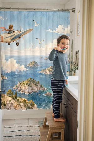 Child brushing teeth in a family bathroom with the Coastal Explorer shower curtain